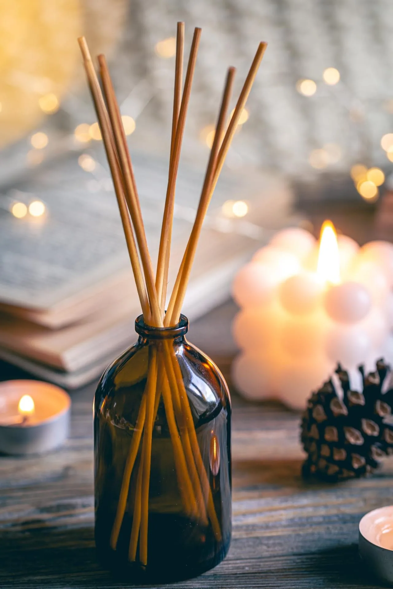 Fragrance atelier shelf with amber glass bottles and soft light